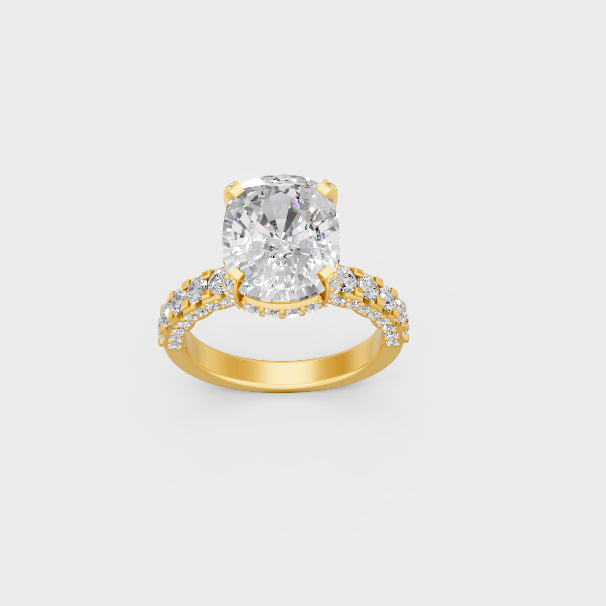 Close up detail of cushion center stone and round accent diamonds on yellow gold band