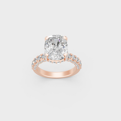 Macro close up of cushion center and accent stones on romantic rose gold band