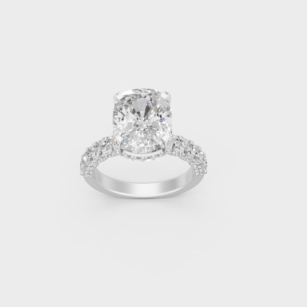Detailed macro shot of cushion center diamond and accent stones in white metal setting