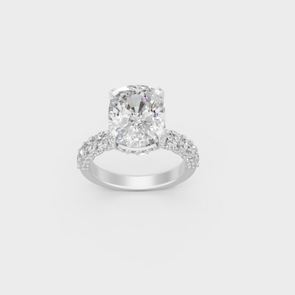 Detailed macro shot of cushion center diamond and accent stones in white metal setting