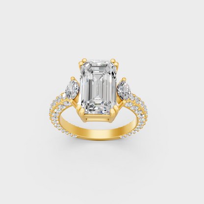 Close up detail of emerald round and marquise cut lab diamonds on yellow gold band