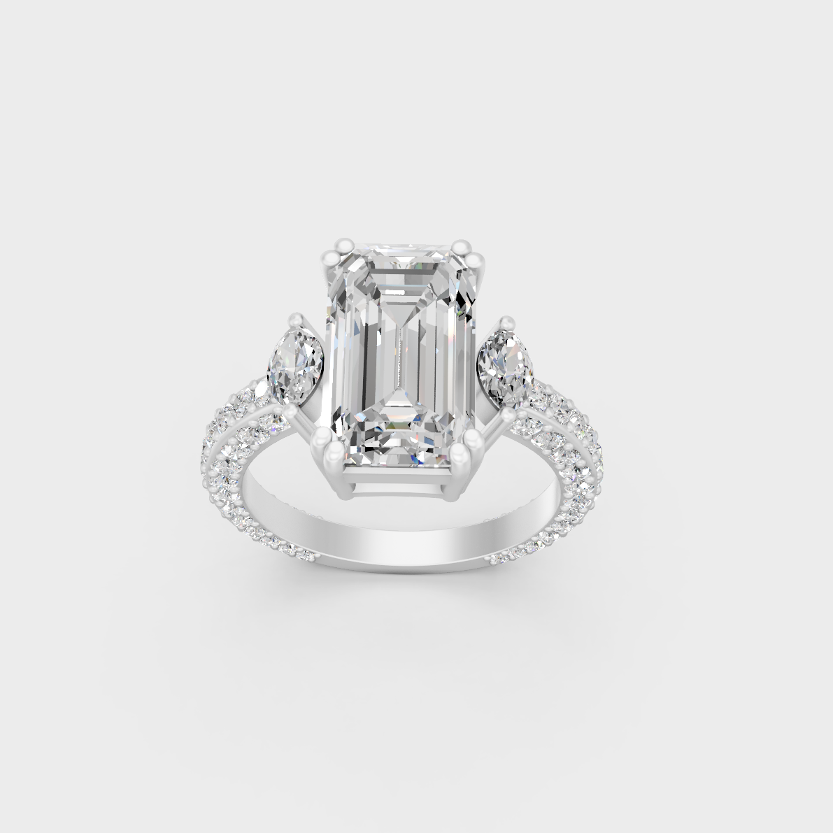 Detailed macro shot of emerald round and marquise cut diamonds in white metal setting