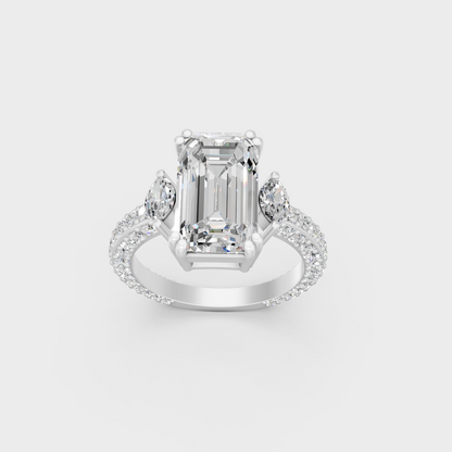 Detailed macro shot of emerald round and marquise cut diamonds in white metal setting