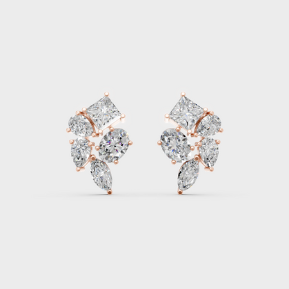 Pair of Ethical Luxury Multishape Diamond Studs glowing on a rose-hued 18K Rose Gold Setting.