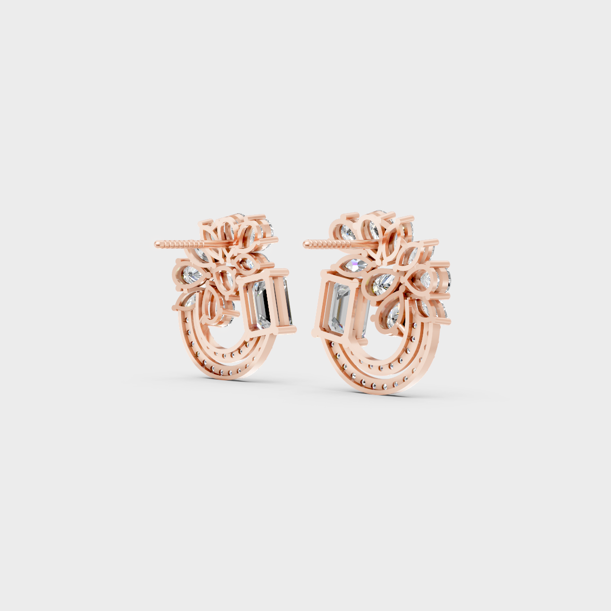 Warm light refracting through Multishape Sustainable Diamond Stud Earrings in 18K Rose Gold.