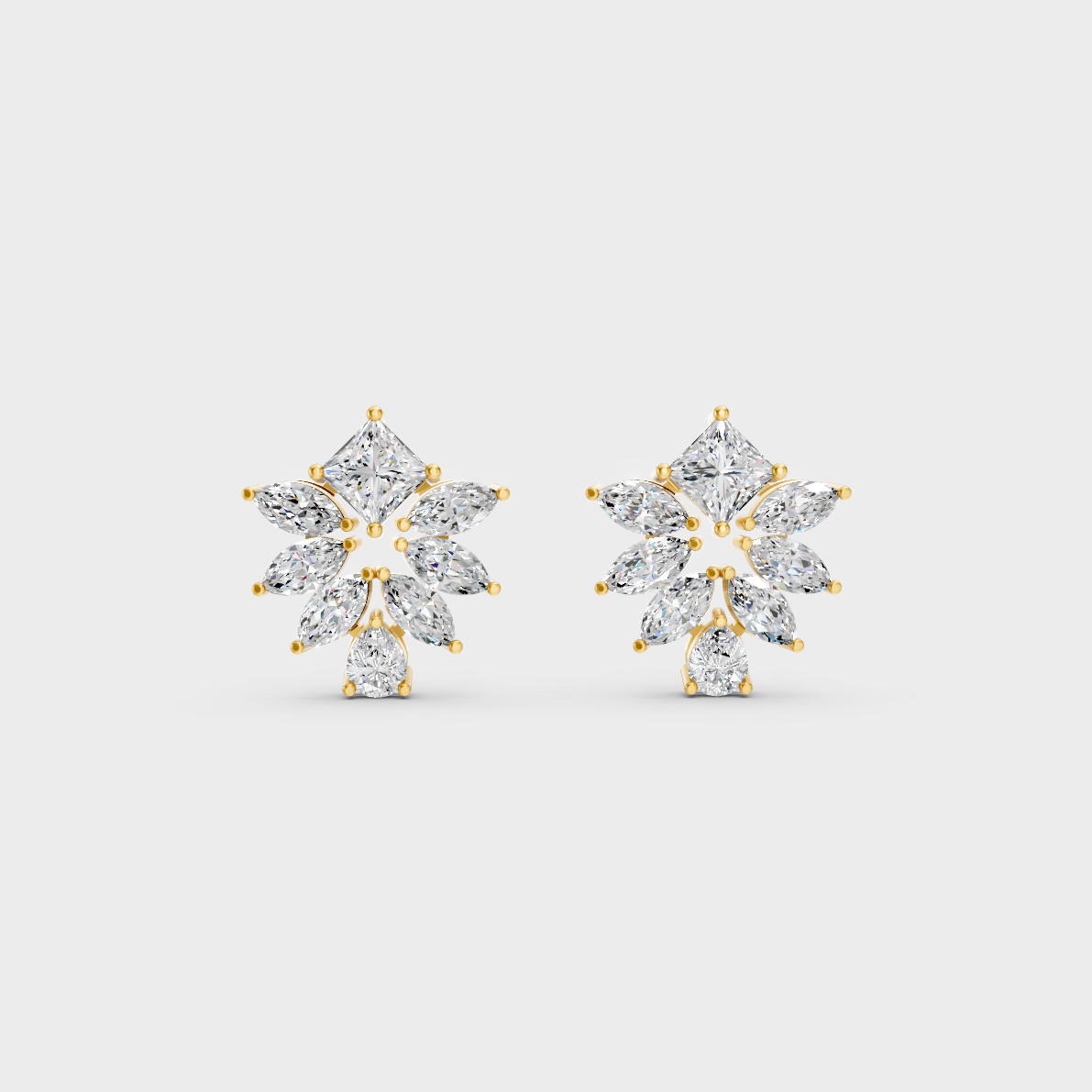 On-model ear wearing a pair of 2.30ct Princess, Pear, and Marquise Lab Diamond Stud Earrings in classic 9K Yellow Gold.
