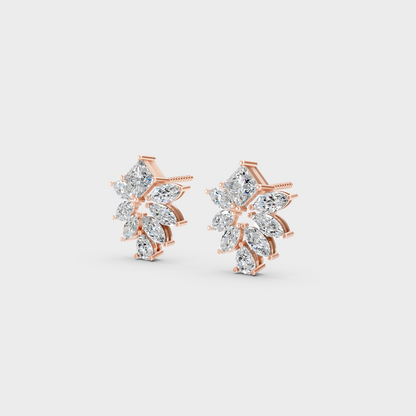Pair of Ethical Luxury Multishape Diamond Studs glowing on a rose-hued 18K Rose Gold Setting.