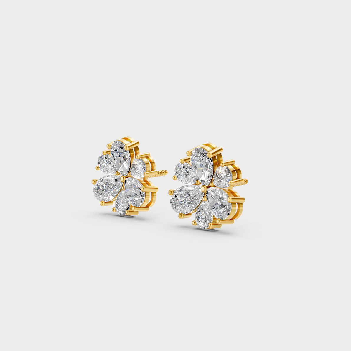 Side angle showing the secure backing and Brilliant Sparkle of Ethical Luxury Pear Cut Studs in 18K Yellow Gold.
