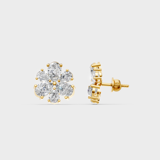 Close-up shot of 2.30 Carat Pear Cut Lab-Grown Diamond Stud Earrings set in warm 14K Yellow Gold.