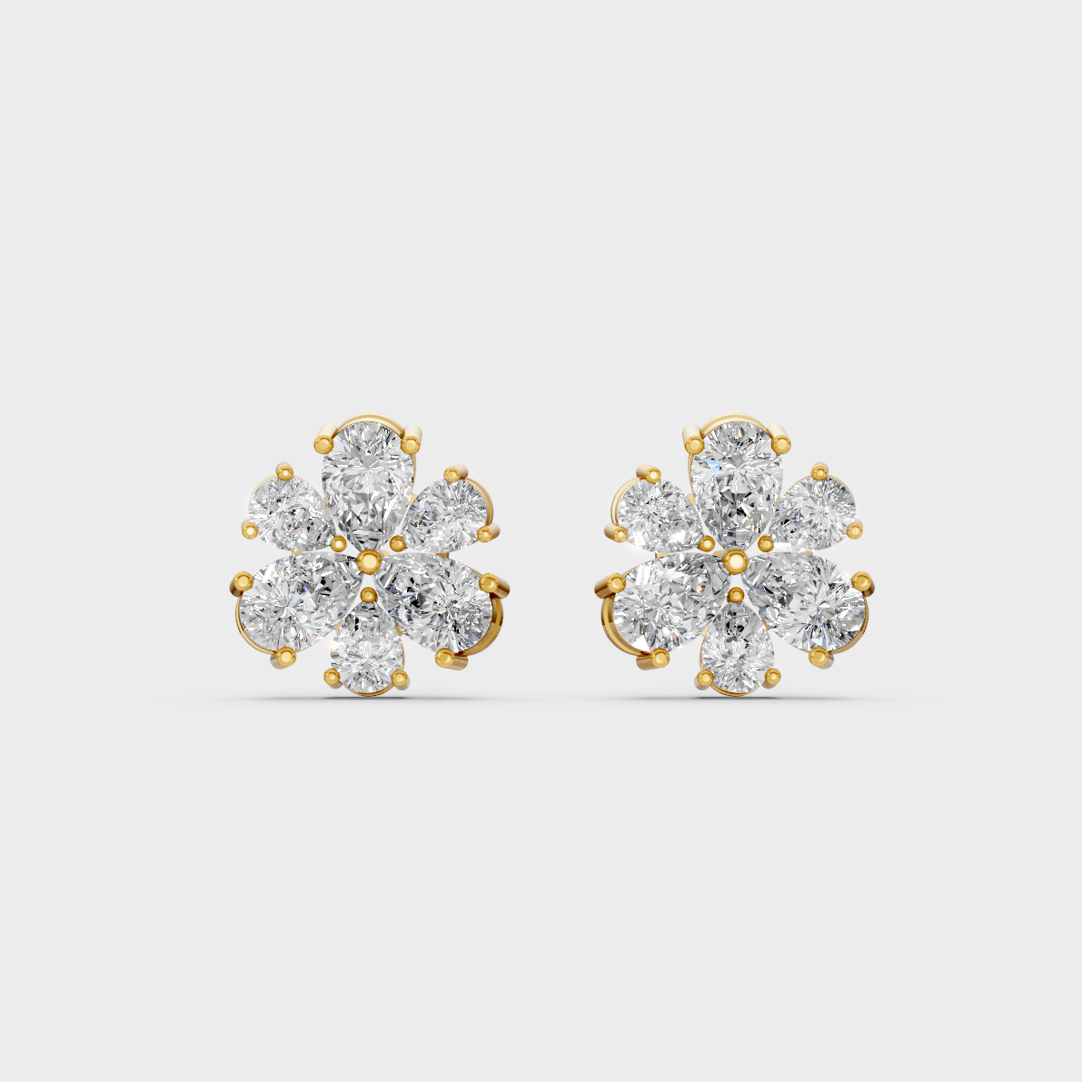 On-model ear wearing a pair of 2.30ct Pear Cut Lab-Grown Diamond Studs in classic 9K Yellow Gold.