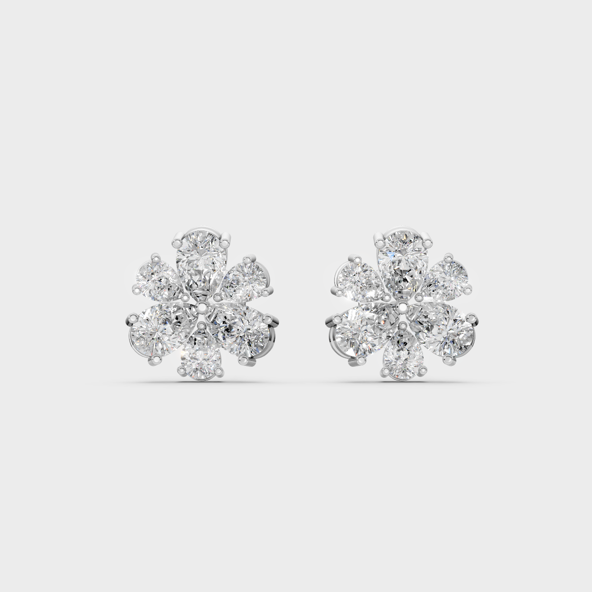 On-ear perspective highlighting the icy Brilliant Sparkle of 2.30ct White Gold Pear Diamond Studs.