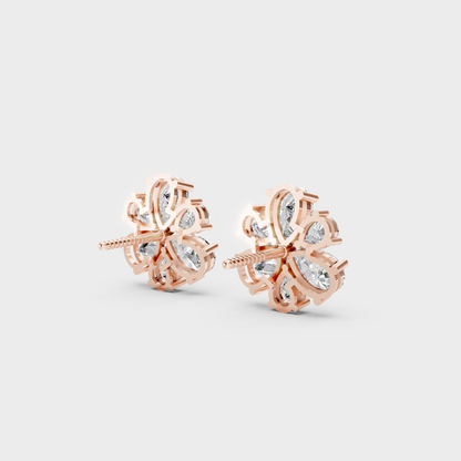 Premium jewelry box opening to reveal 2.30ct Pear Cut Lab-Grown Diamond Studs in 14K Rose Gold.