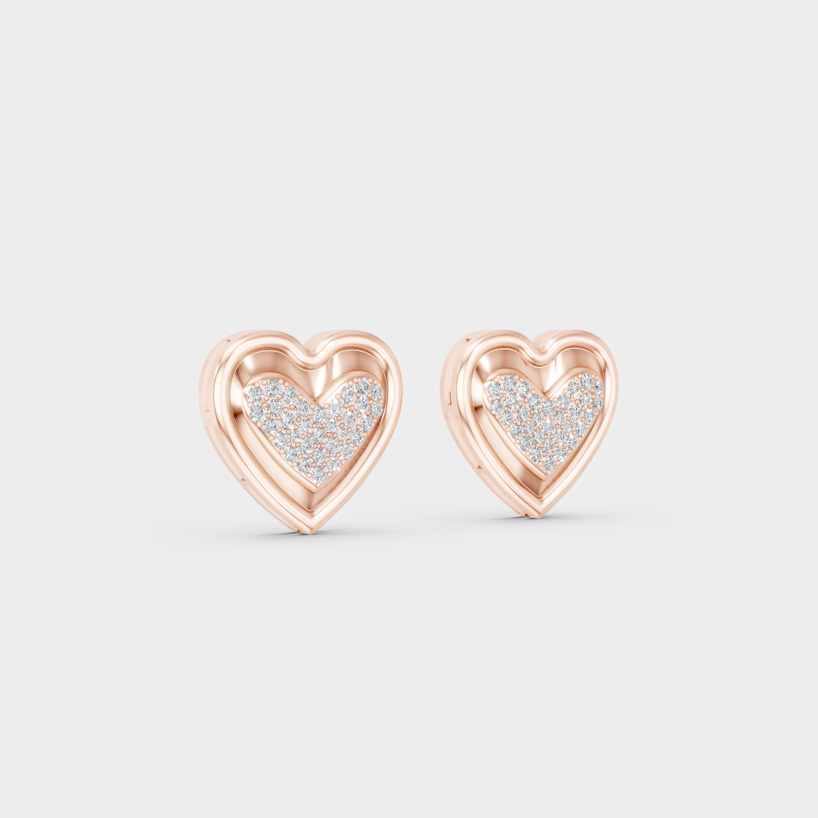 Warm light refracting through Round Cut Sustainable Diamond Heart Earrings in 18K Rose Gold.