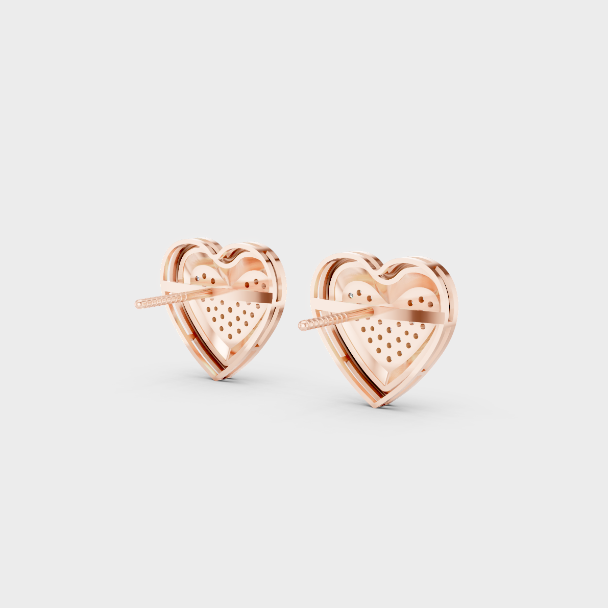 Premium jewelry box opening to reveal 0.50ct Round Lab-Grown Diamond Heart Studs in 14K Rose Gold.