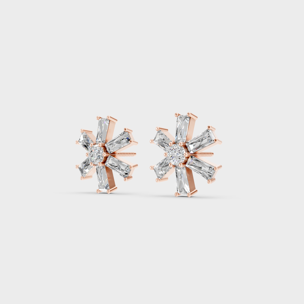 Pair of Ethical Luxury Baguette and Round Diamond Studs glowing on a rose-hued 18K Rose Gold Setting.