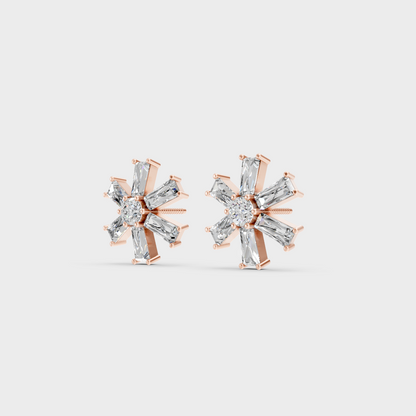 Pair of Ethical Luxury Baguette and Round Diamond Studs glowing on a rose-hued 18K Rose Gold Setting.