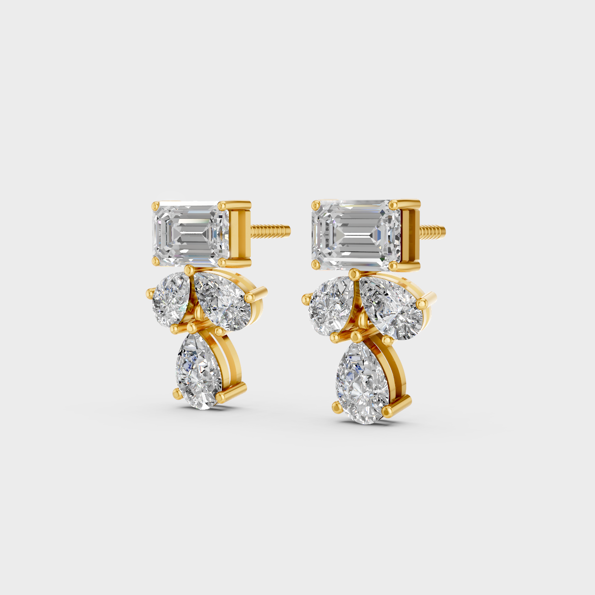 Side angle showing the secure backing and Brilliant Sparkle of Ethical Luxury Emerald and Pear Studs in 18K Yellow Gold.