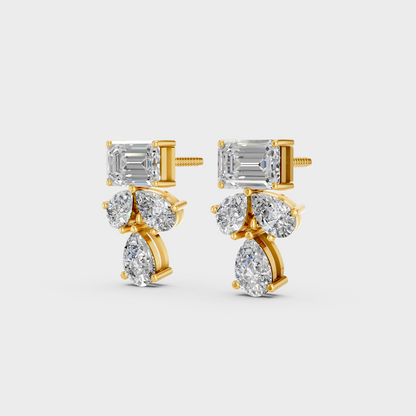 Side angle showing the secure backing and Brilliant Sparkle of Ethical Luxury Emerald and Pear Studs in 18K Yellow Gold.