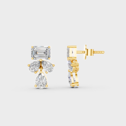 Close-up shot of 2.06 Carat Emerald and Pear Cut Lab-Grown Diamond Stud Earrings set in warm 14K Yellow Gold.