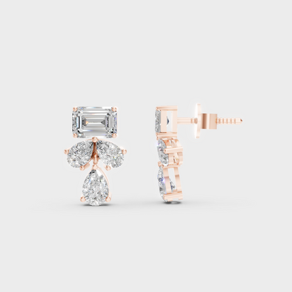 Romantic profile of 2.06 Carat Emerald and Pear Cut Lab-Grown Diamond Stud Earrings in blush 14K Rose Gold.