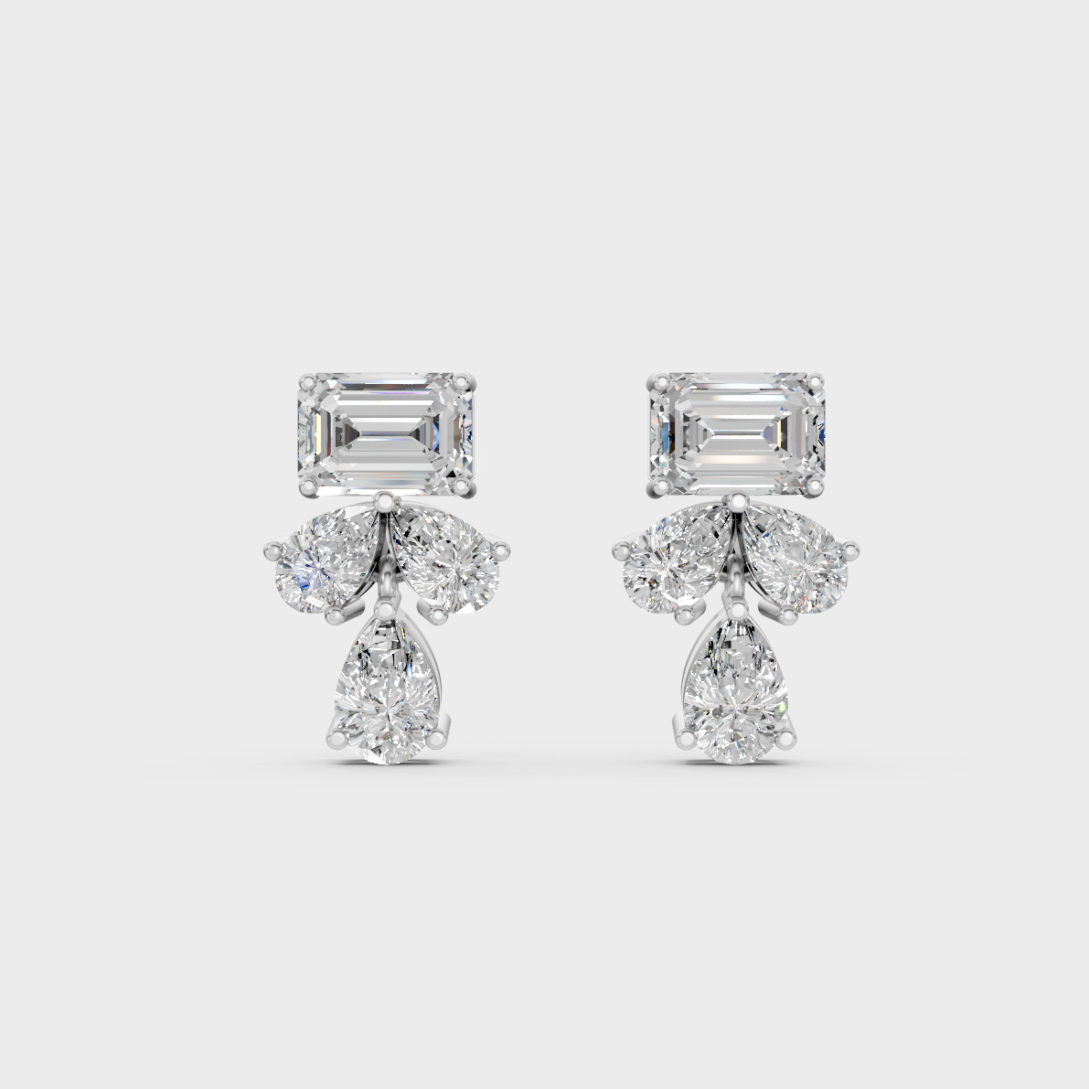 On-ear perspective highlighting the icy Brilliant Sparkle of 2.06ct White Gold Emerald Pear Diamond Studs.
