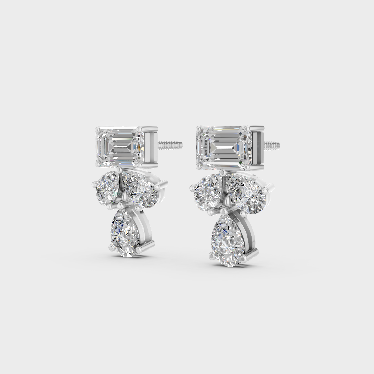 Frontal view of Ethical Luxury Studs featuring Emerald and Pear Cut Lab Diamonds set in 14K White Gold.