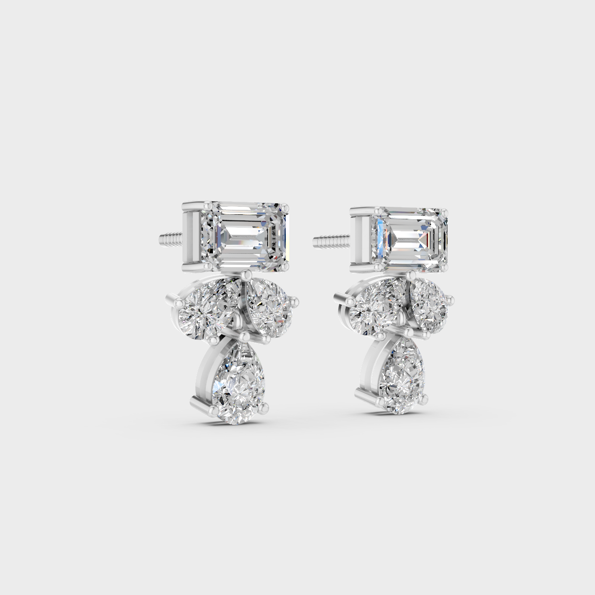 Precise prong placement securing brilliant stones on 950 Platinum Emerald and Pear Lab Diamond Stud Earrings.