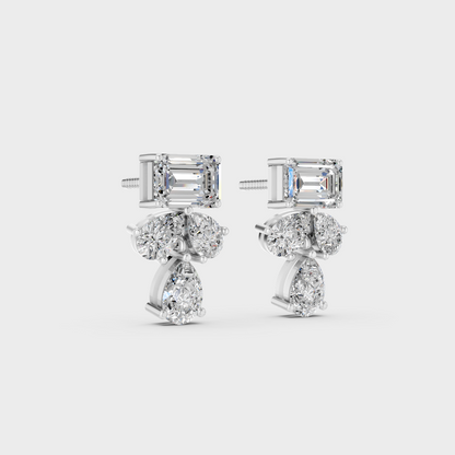 Precise prong placement securing brilliant stones on 950 Platinum Emerald and Pear Lab Diamond Stud Earrings.