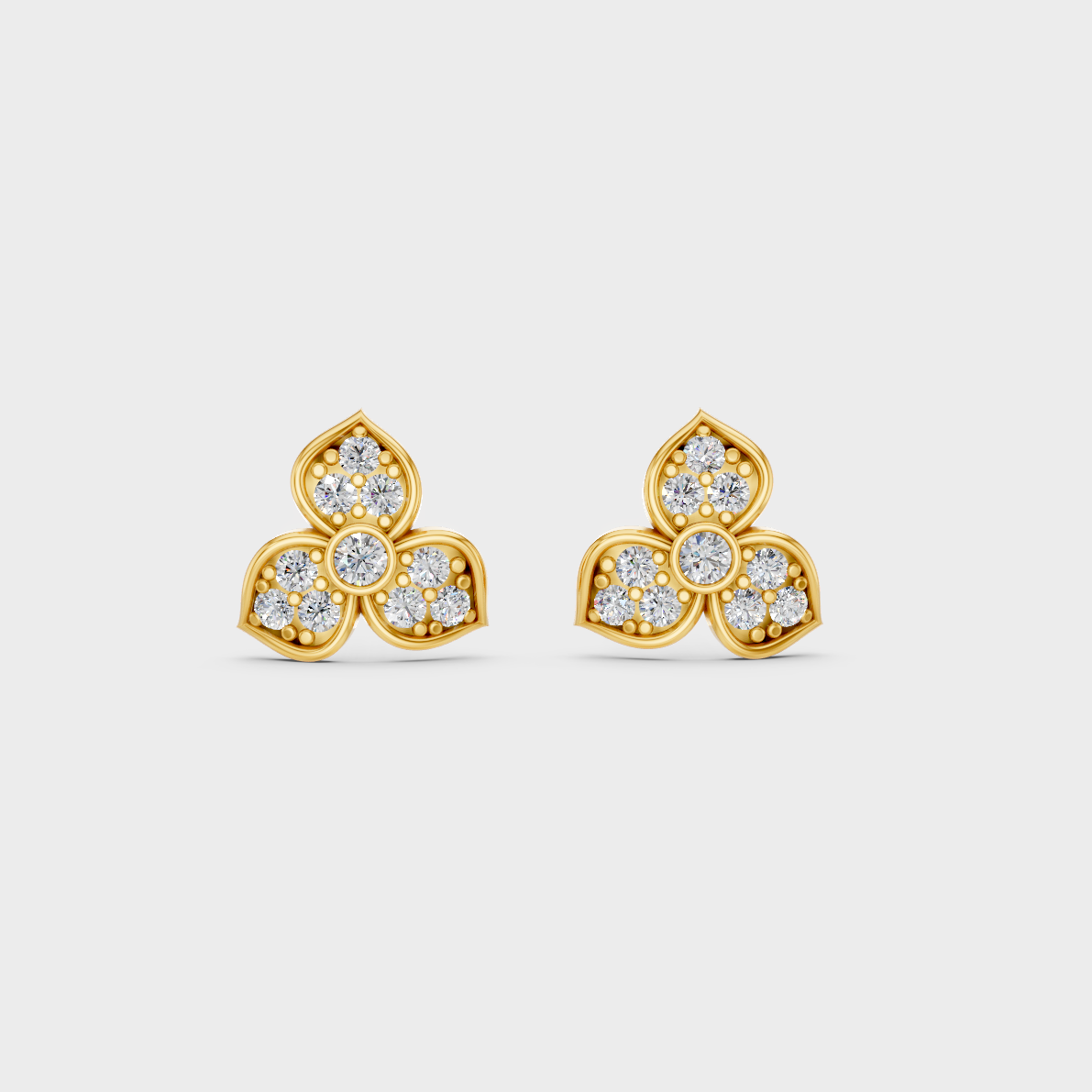 On-model ear wearing a pair of 0.66ct Round Lab-Grown Diamond Studs in classic 9K Yellow Gold.
