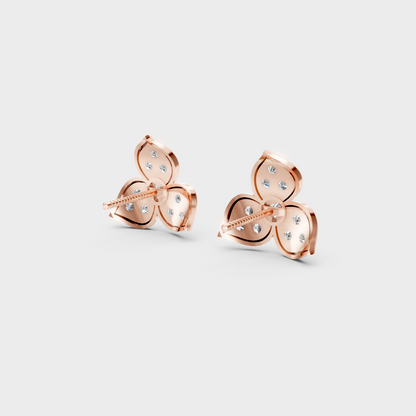 Premium jewelry box opening to reveal 0.66ct Round Lab-Grown Diamond Studs in 14K Rose Gold.