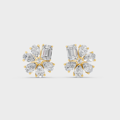 On-model ear wearing a pair of 2.46ct Emerald and Pear Lab Diamond Stud Earrings in classic 9K Yellow Gold.