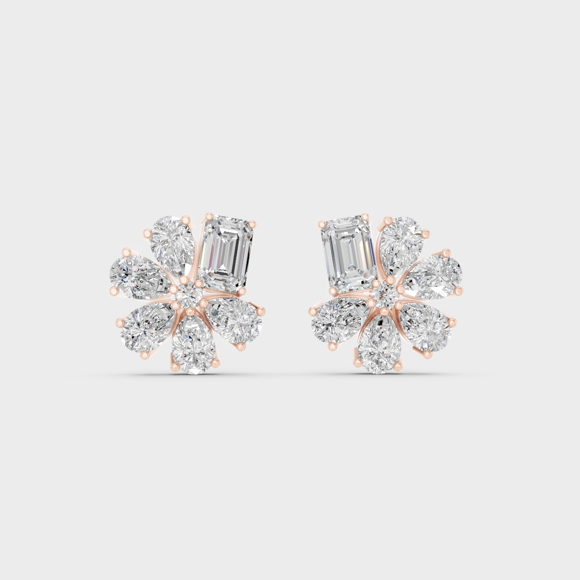 Top-down view displaying the Brilliant Sparkle of 2.46ct Emerald and Pear Diamond Studs in 9K Rose Gold.