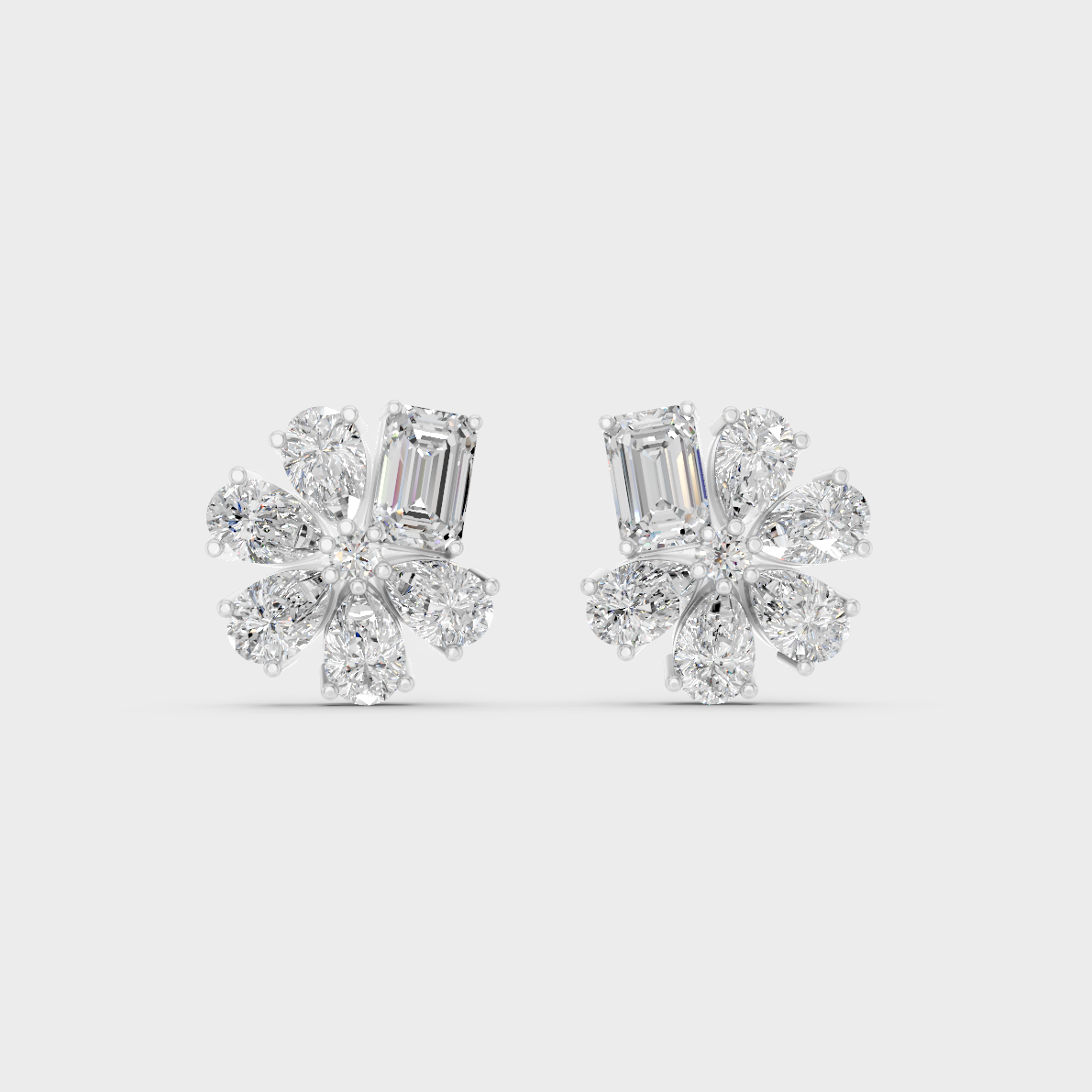 On-ear perspective highlighting the icy Brilliant Sparkle of 2.46ct White Gold Emerald Pear Diamond Studs.