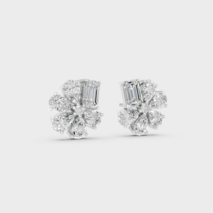 Precise prong placement securing brilliant stones on 950 Platinum Emerald and Pear Lab Diamond Stud Earrings.