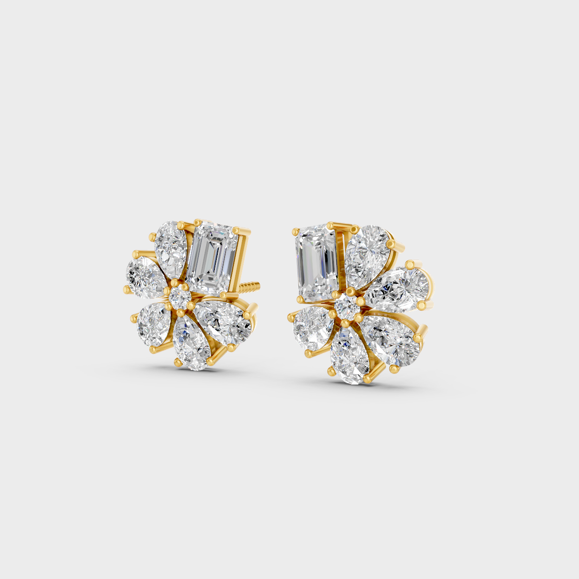 Side angle showing the secure backing and Brilliant Sparkle of Ethical Luxury Emerald and Pear Studs in 18K Yellow Gold.