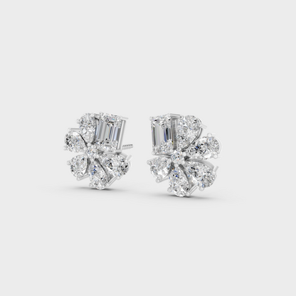 Frontal view of Ethical Luxury Studs featuring Emerald and Pear Cut Lab Diamonds set in 14K White Gold.