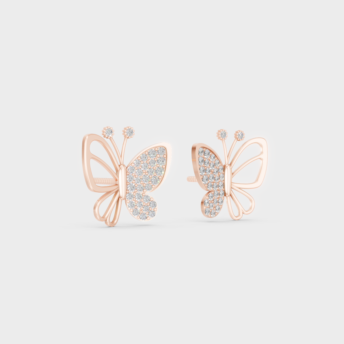 Warm light refracting through Round Cut Sustainable Diamond Butterfly Earrings in 18K Rose Gold.