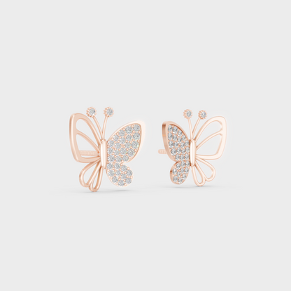 Warm light refracting through Round Cut Sustainable Diamond Butterfly Earrings in 18K Rose Gold.