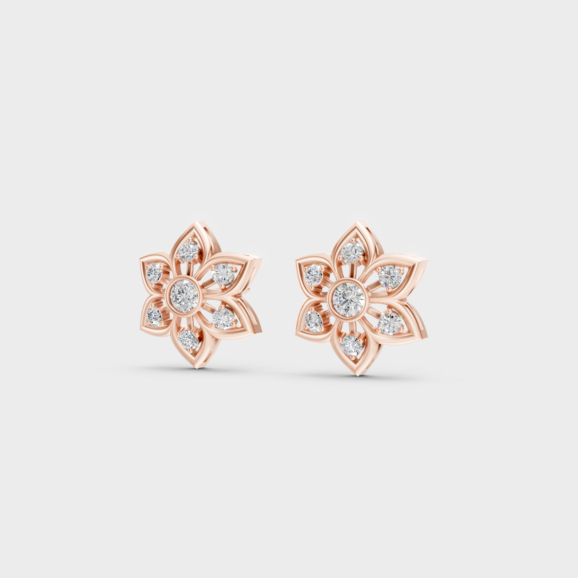 Pair of Ethical Luxury Diamond Solitaire Studs glowing on a rose-hued 18K Rose Gold Setting.