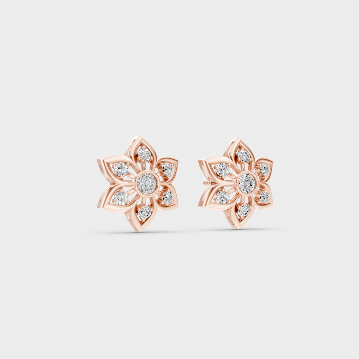 Warm light refracting through Round Cut Sustainable Diamond Stud Earrings in 18K Rose Gold.