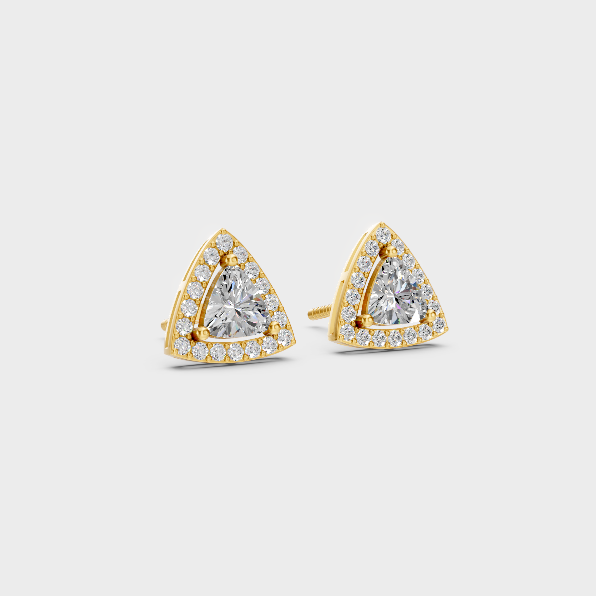Macro studio lighting catching the fire of Sustainable Trillion Cut Lab Diamond Halo Earrings in 18K Yellow Gold.