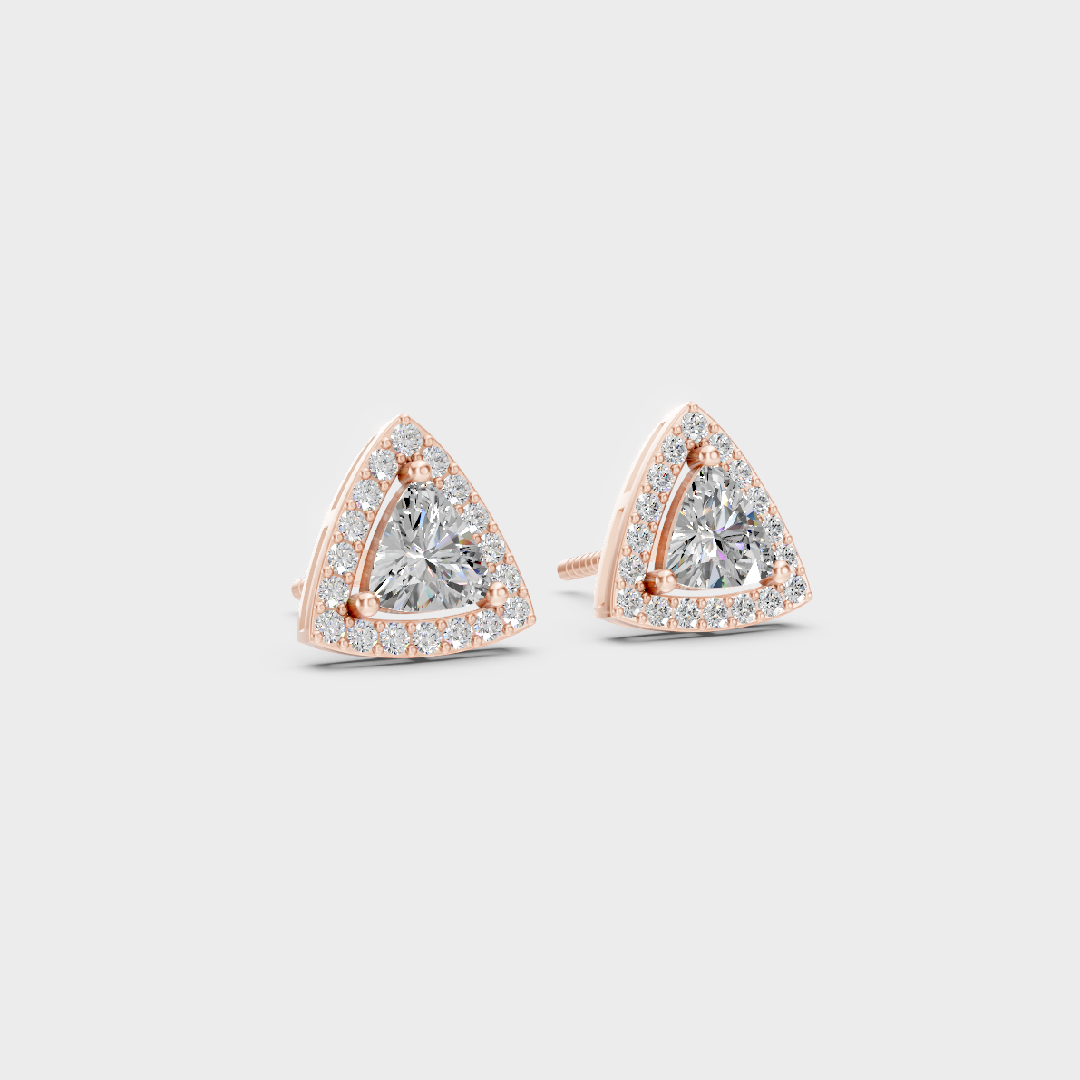 Warm light refracting through Trillion Round Sustainable Diamond Halo Earrings in 18K Rose Gold.