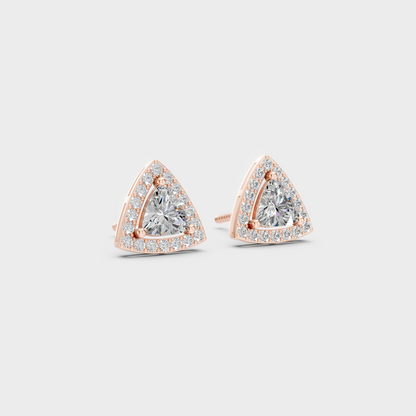 Warm light refracting through Trillion Round Sustainable Diamond Halo Earrings in 18K Rose Gold.