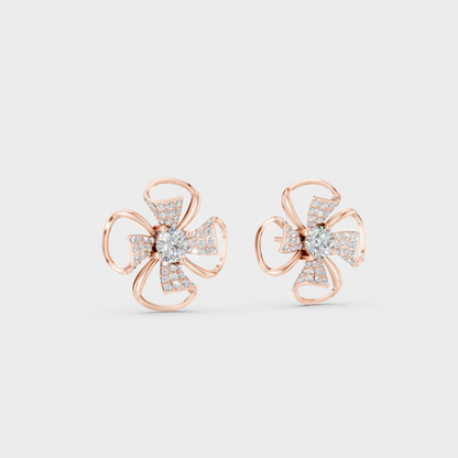 Warm light refracting through Round Cut Sustainable Diamond Stud Earrings in 18K Rose Gold.