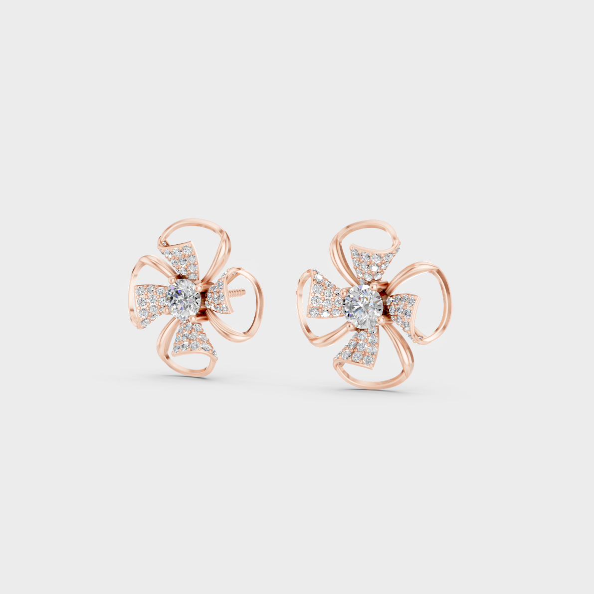 Pair of Ethical Luxury Diamond Solitaire Studs glowing on a rose-hued 18K Rose Gold Setting.