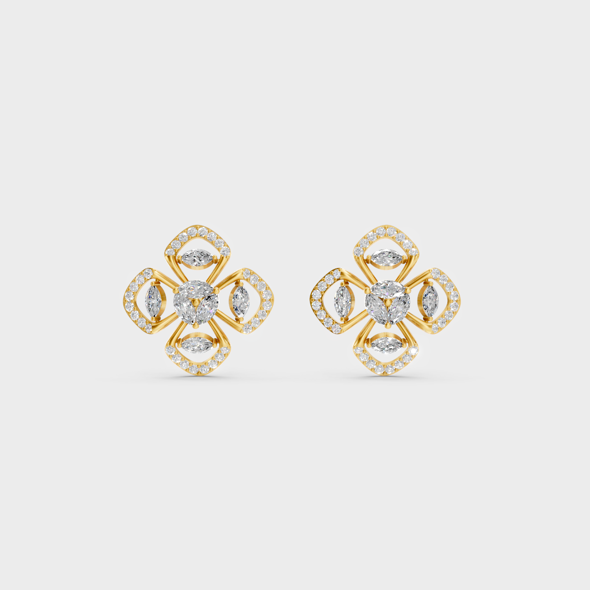 On-model ear wearing a pair of 1.14ct Round and Marquise Lab Diamond Stud Earrings in classic 9K Yellow Gold.