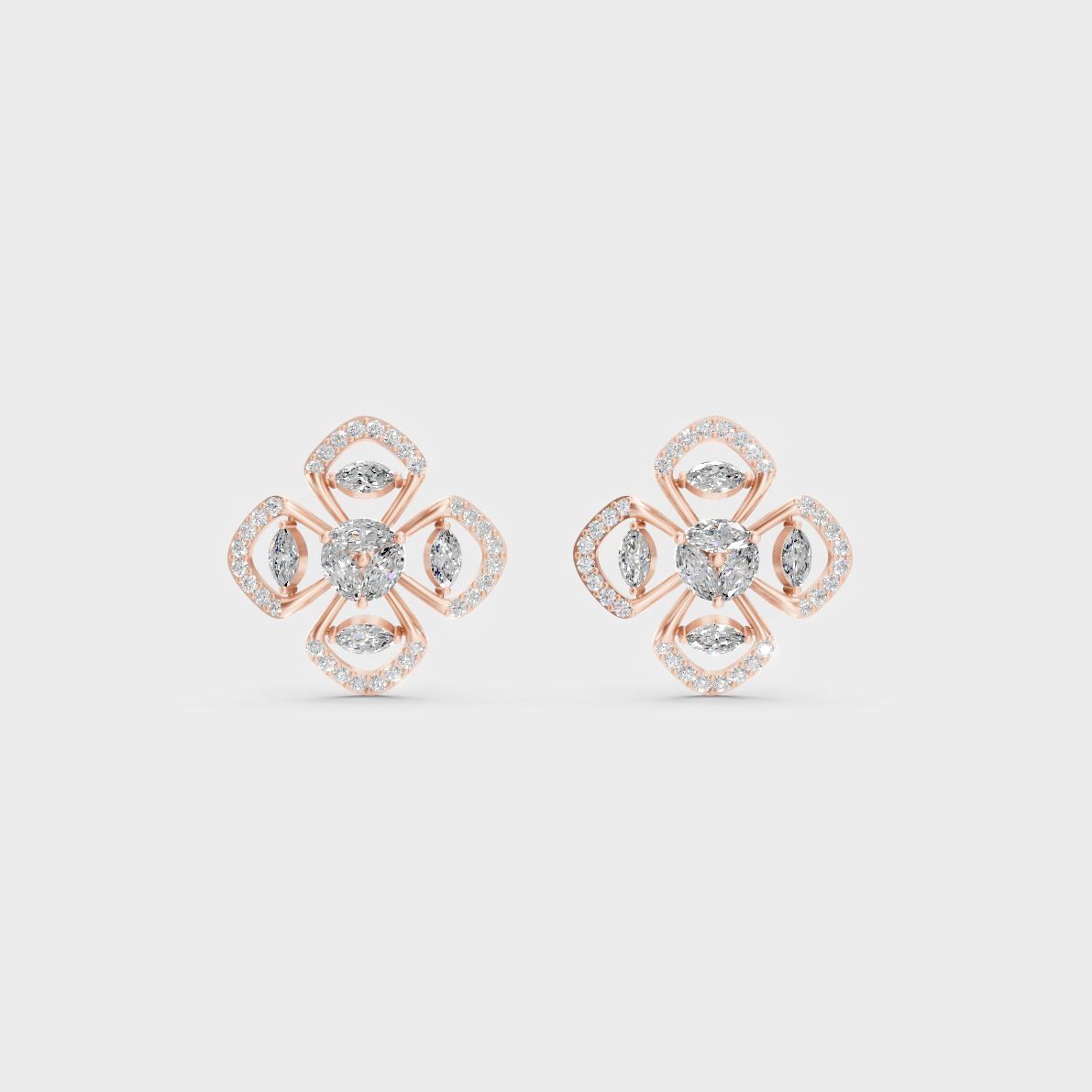 Warm light refracting through Round Marquise Sustainable Diamond Stud Earrings in 18K Rose Gold.