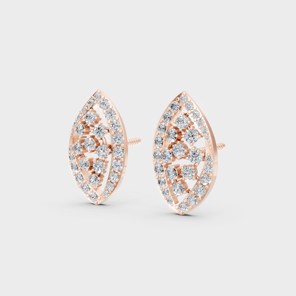 Pair of Ethical Luxury Diamond Solitaire Studs glowing on a rose-hued 18K Rose Gold Setting.