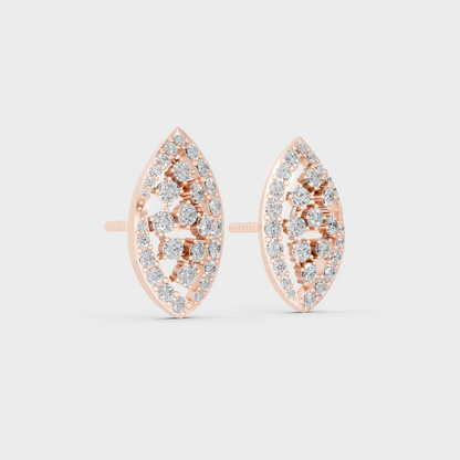 Warm light refracting through Round Cut Sustainable Diamond Stud Earrings in 18K Rose Gold.