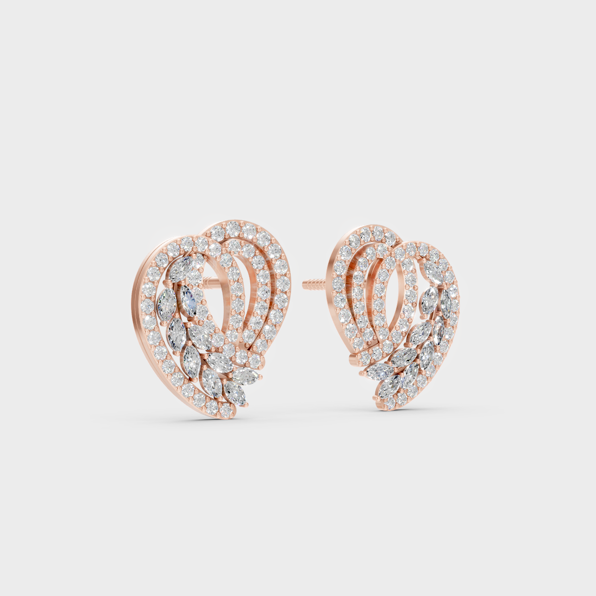 Warm light refracting through Round Marquise Sustainable Diamond Stud Earrings in 18K Rose Gold.